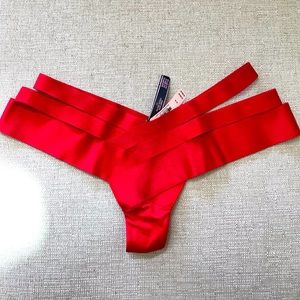 Brand new Victoria’s Secret bondage panty. Red three strap on side. Thong back.